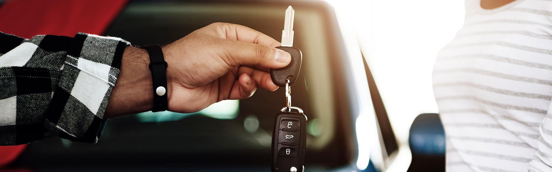 person handing over keys